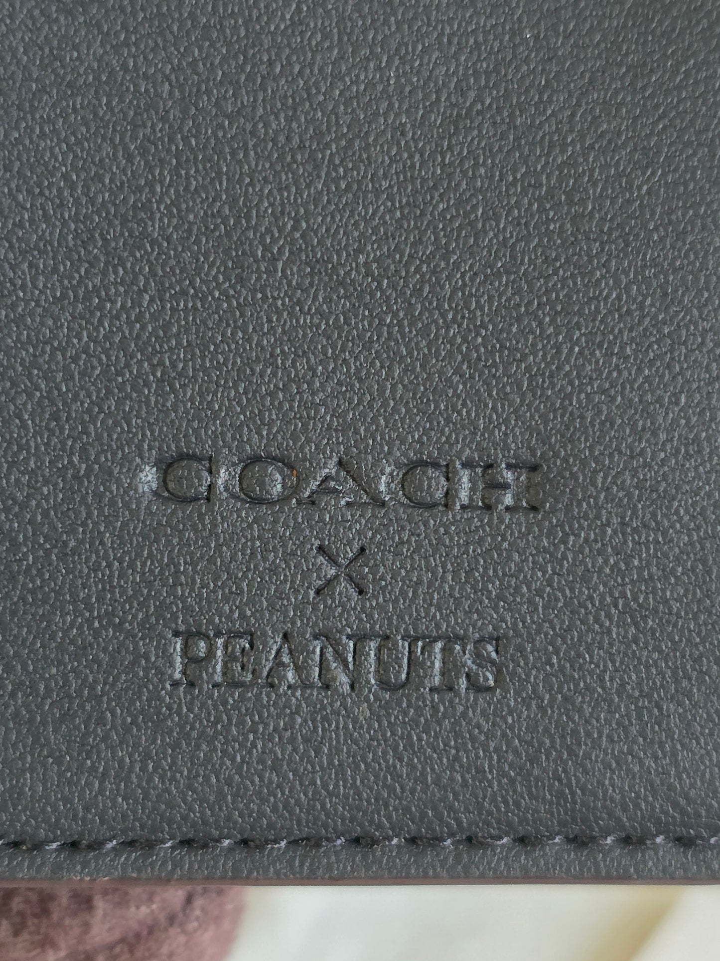 PRELOVED and in PRISTINE CONDITION COACH X SNOOPY special edition BIFOLD WALLET